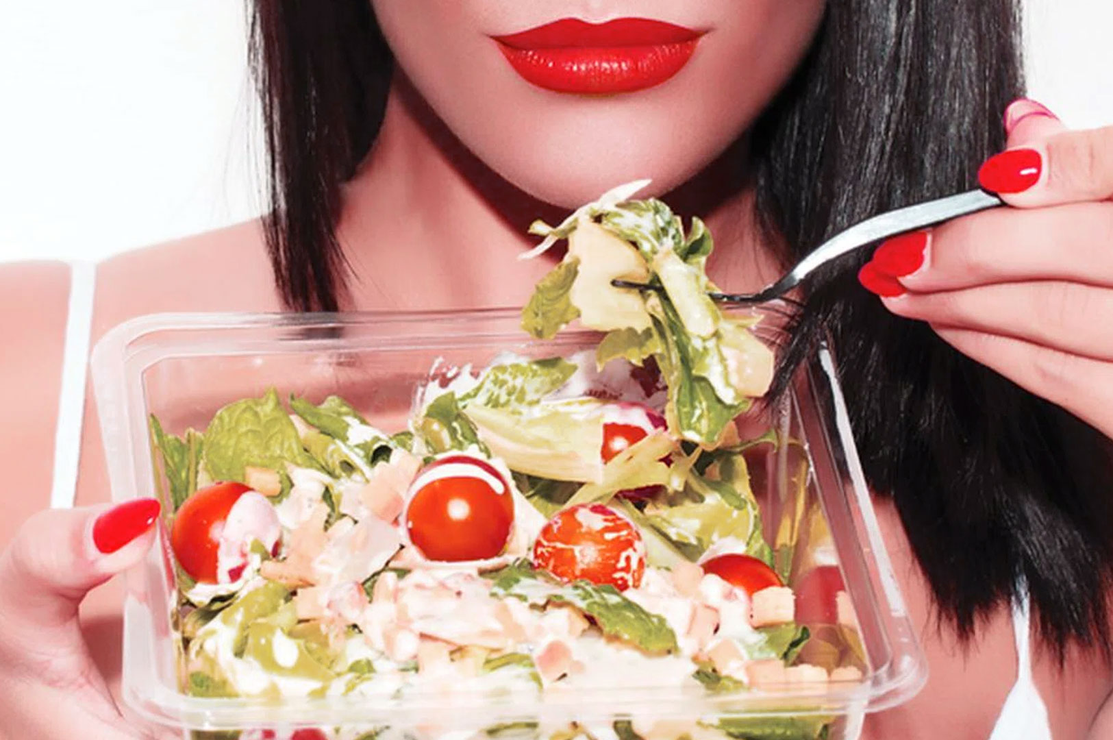 Woman holding a vegetable salad