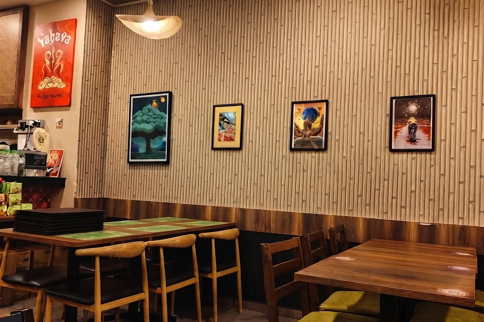 Warung Ijo restaurant interior featuring bamboo-patterned walls and modern wooden seating.