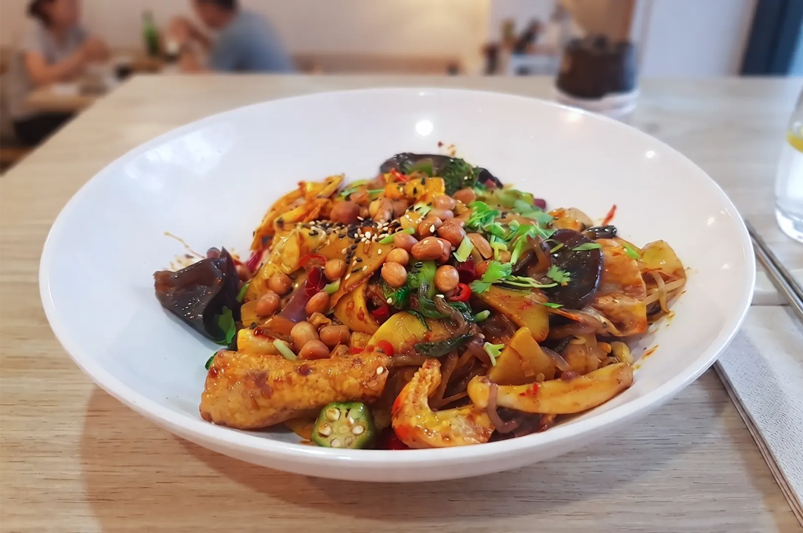 A bowl of flavorful vegetarian mala with dried chilli and herbs at Nature Vegetarian Delights in Sengkang.