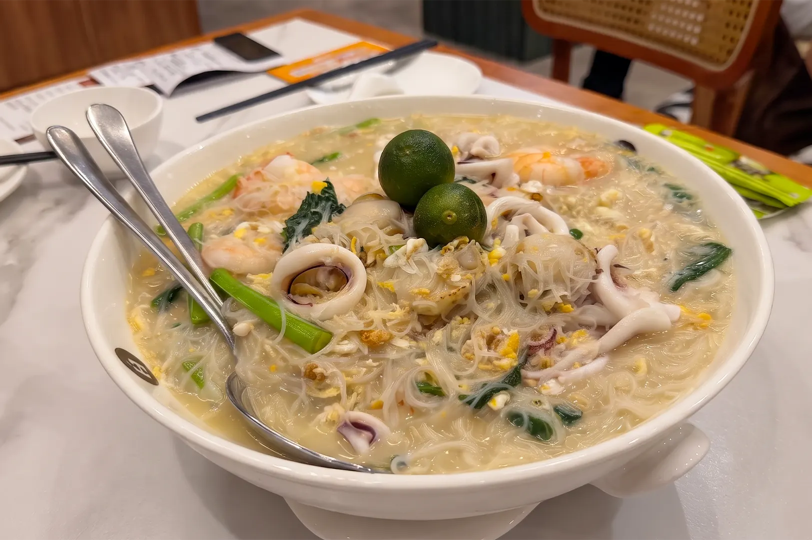 White Restaurant signature white beehoon with seafood and calamansi served at Suntec City.