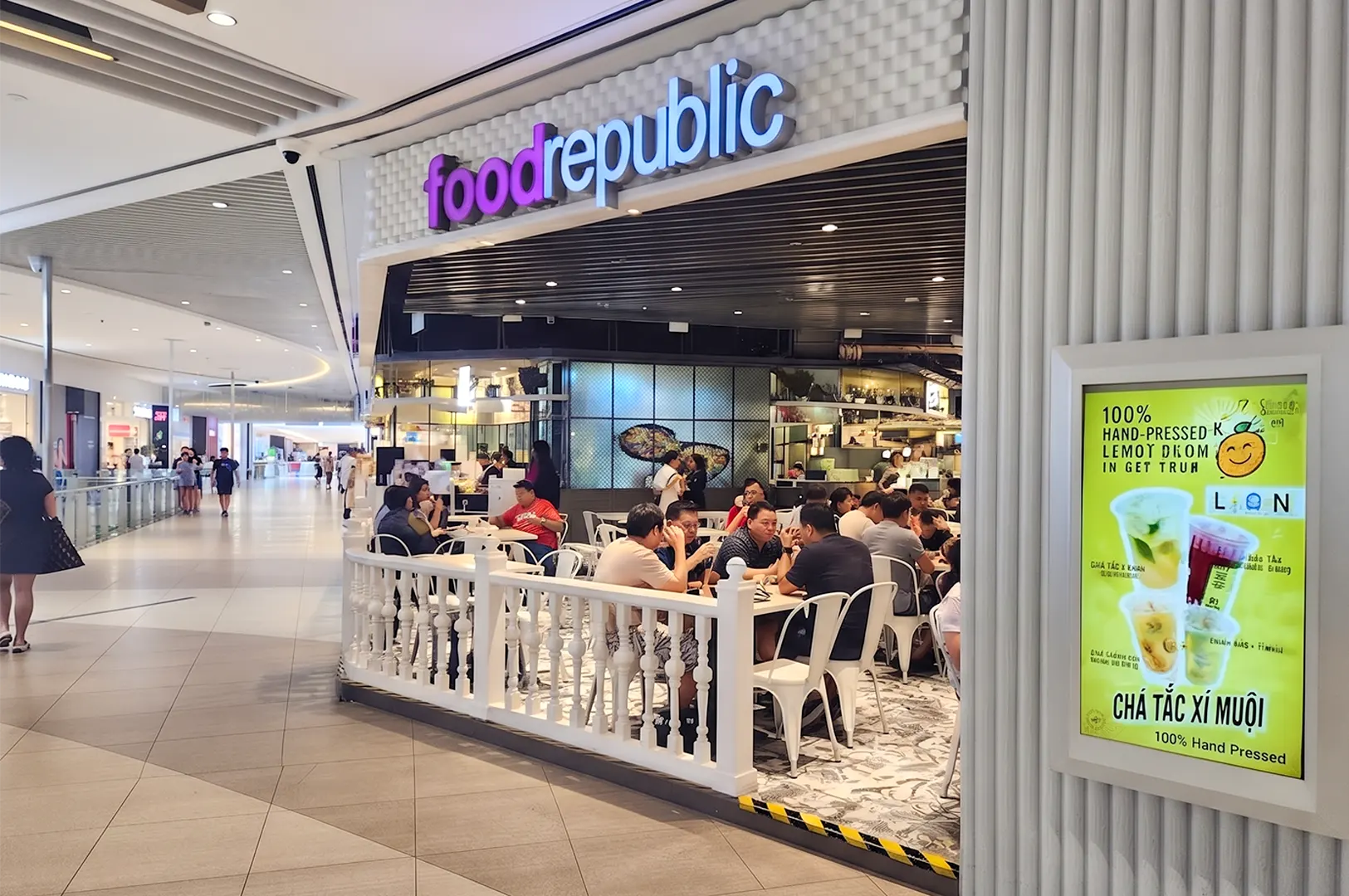 Food Republic food court storefront with customers dining inside a modern shopping mall.