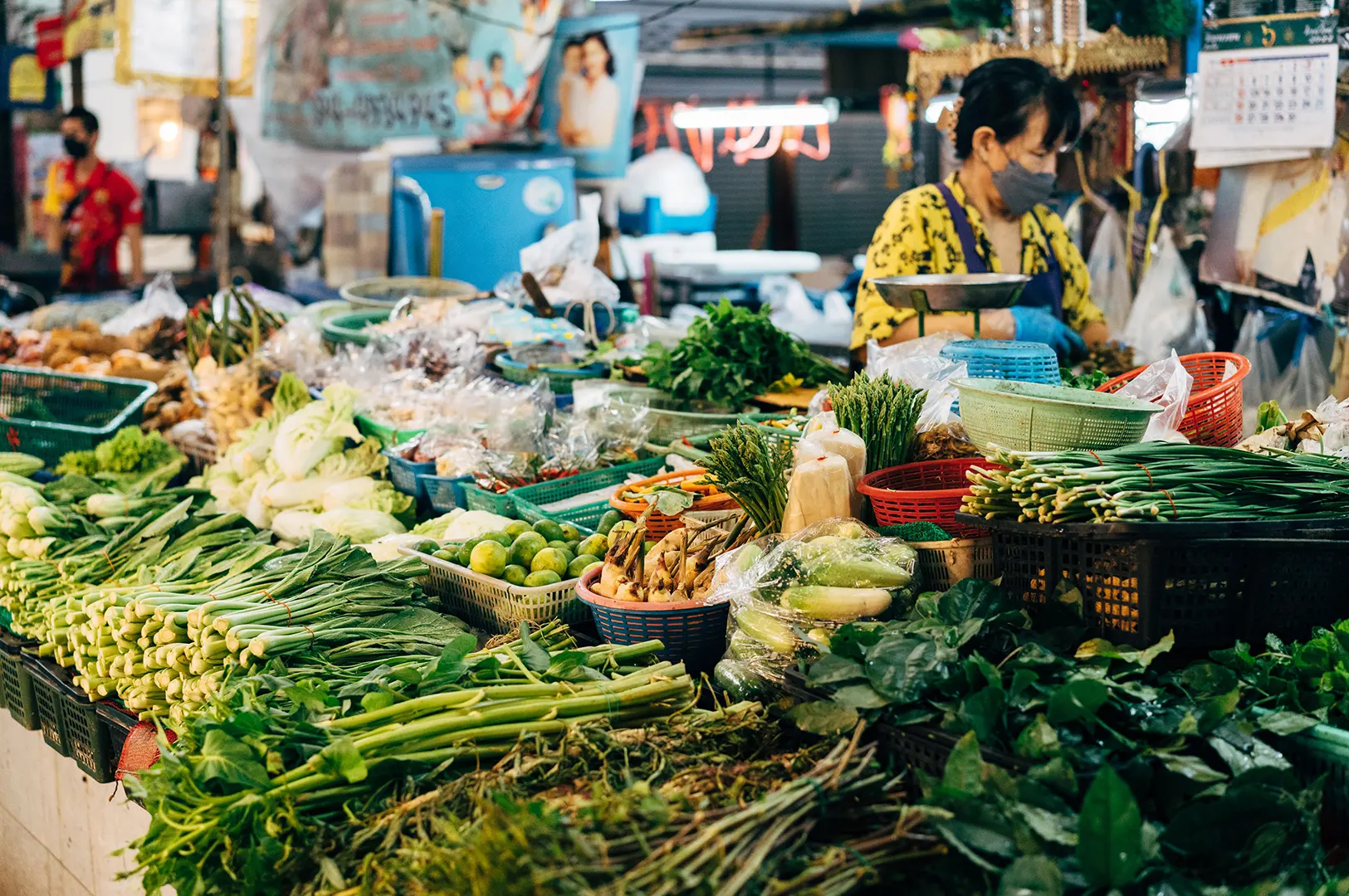 Fresh vegetables displayed at a local Asian market stall.