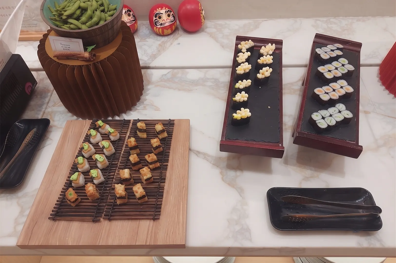 Lotus Vegetarian Restaurant buffet spread with sushi and appetizers in Singapore.