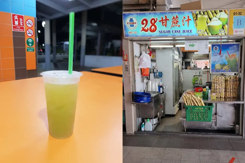 Fresh sugar cane juice cup with a straw next to a Singapore hawker stall unit 28 Sugar Cane Juice.