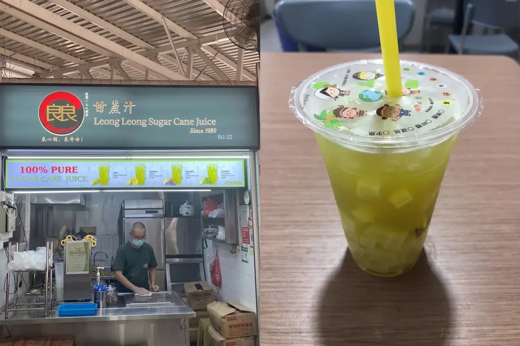 Fresh sugarcane juice in a plastic cup with a straw at Queen Street Chan Kee Sugar Cane Juice hawker stall.