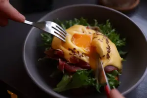 Savory breakfast bowl with a soft-boiled egg, greens, and ham for an anti-boring morning meal.