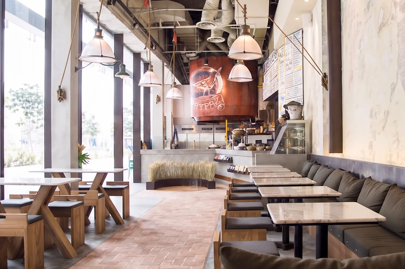 Grain Traders Singapore interior dining space with industrial design and seating.